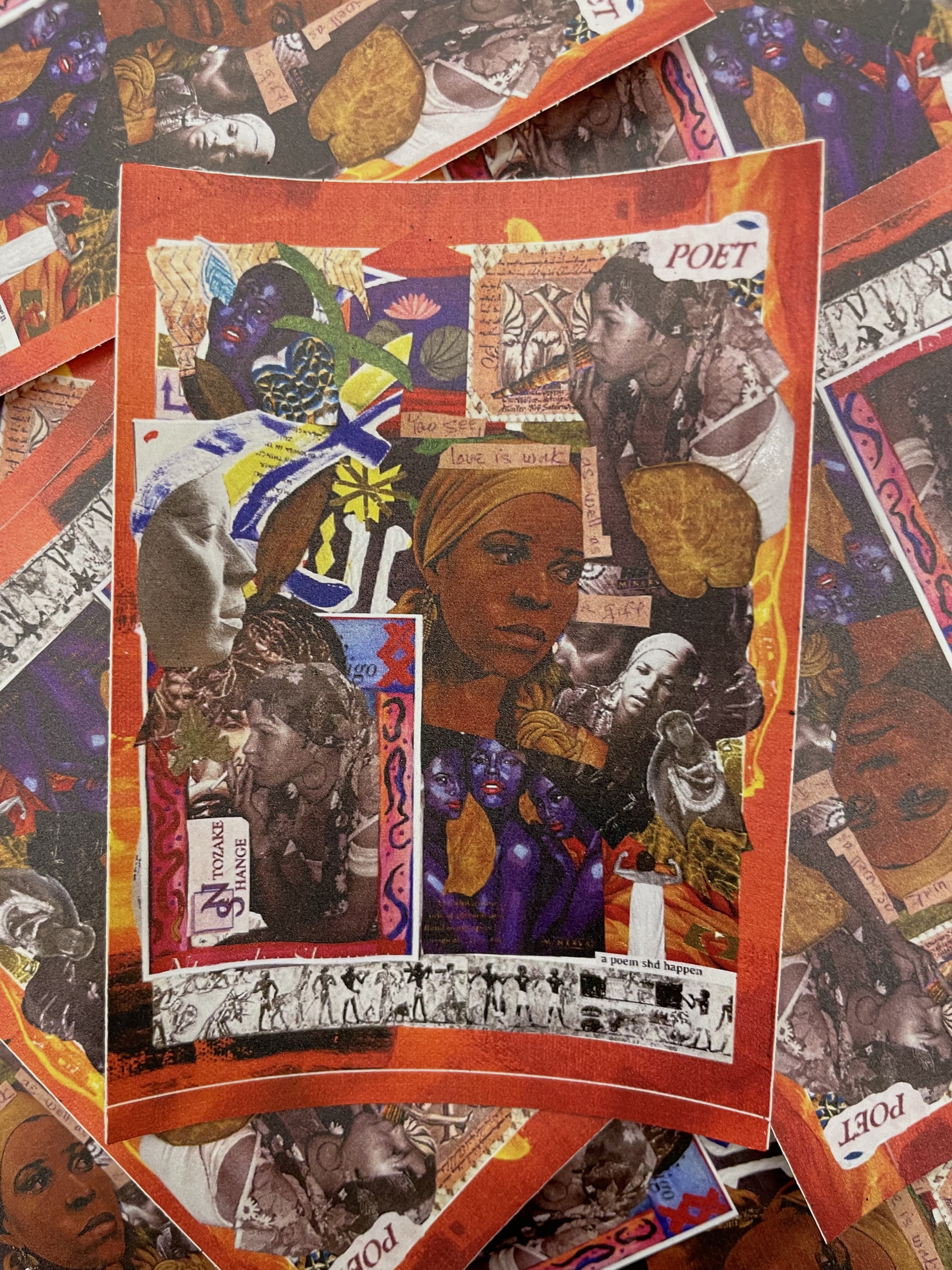 Stickers of the DHC's collaborative collage are haphazardly piled on top of each other. 