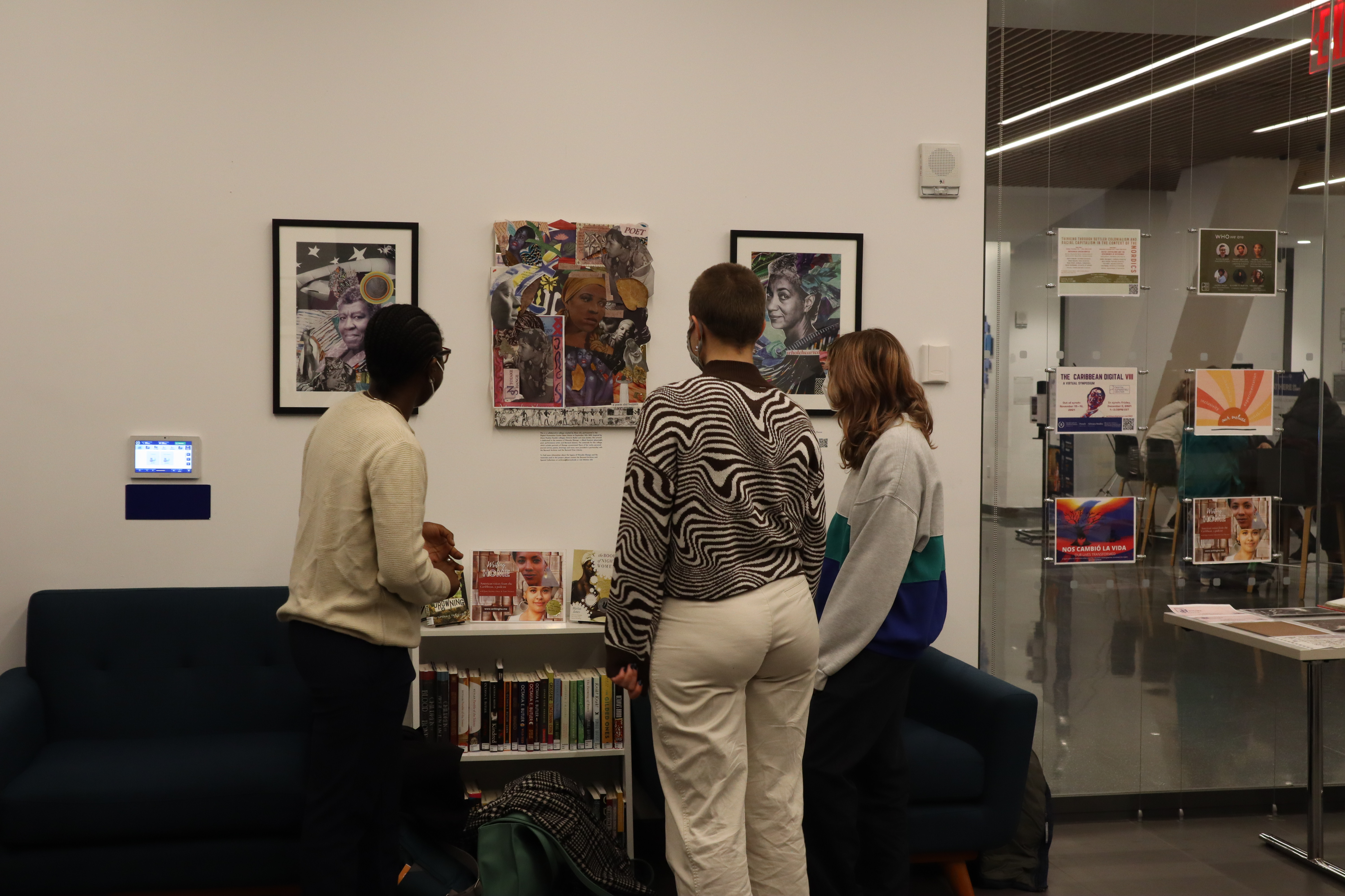 Three people are seen viewing the DHC's collaborative collage